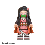 Load image into Gallery viewer, Nezuko Kamado custom brick minifigure from Demon Slayer, with a bamboo muzzle, pink kimono and long black hair.