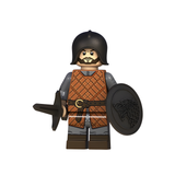 Load image into Gallery viewer, House Stark shield warrior custom brick minifigure from Game of Thrones, with a black helmet, round wolf-emblem shield and sword.