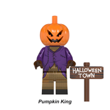 Load image into Gallery viewer, Pumpkin King custom brick minifigure from The Nightmare Before Christmas, with a jack-o'-lantern head, purple jacket and Halloween Town sign.