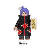 Load image into Gallery viewer, Konan custom brick minifigure from Naruto, with purple hair, a paper flower and paper accessory.