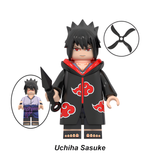 Load image into Gallery viewer, Sasuke Uchiha Akatsuki outfit custom brick minifigure from Naruto, with black hair, red eyes, an Akatsuki cloak and kunai.