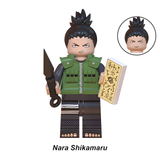 Load image into Gallery viewer, Shikamaru Nara custom brick minifigure from Naruto, with tied-up black hair, a green vest and paper accessory.