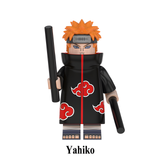 Load image into Gallery viewer, Yahiko Pain appearance custom brick minifigure from Naruto, with orange hair, facial piercings, Akatsuki cloak and black rods.