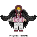 Load image into Gallery viewer, Donquixote Rosinante (Corazon) custom brick minifigure from One Piece, with a black feathered coat, heart-patterned shirt and pistol.