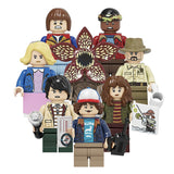 Load image into Gallery viewer, Jane Hopper (Known As Eleven), Michael Wheeler (Known As Mike), Dustin Henderson (Known As Dustin), Lucas Sinclair (Known As Lucas), Will Byers (Known As Will), Chief Jim Hopper (Known As Hopper), Joyce Byers (Known As Joyce), and Demogorgon Stranger Things LEGO-compatible minifigure | custom brick minifigures