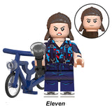 Load image into Gallery viewer, Jane Hopper (Known As Eleven) Stranger Things LEGO-compatible minifigure with bike