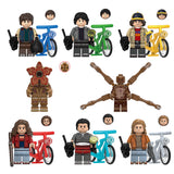 Load image into Gallery viewer, Jane Hopper (Known As Eleven), Michael Wheeler (Known As Mike), Dustin Henderson (Known As Dustin), Will Byers (Known As Will), Nancy Wheeler (Known As Nancy), Steve Harrington (Known As Steve), Henry Creel (Known As Vecna) mutated monster form, and Demogorgon Stranger Things Series 3 LEGO-compatible minifigure set with bikes | custom brick figures
