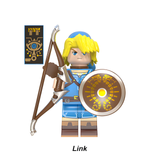 Load image into Gallery viewer, Link blue tunic custom brick minifigure from The Legend of Zelda, with a bow, round shield and Sheikah-style accessory.