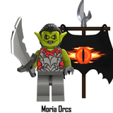 Load image into Gallery viewer, Moria Orc custom brick minifigure from The Lord of the Rings, with green skin, curved sword and Eye of Sauron banner.